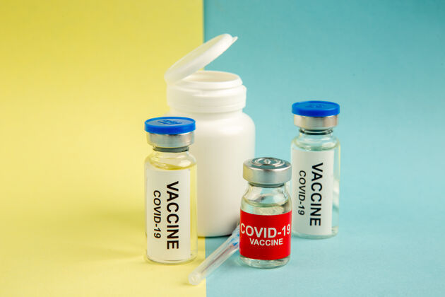 容器前视图冠状病毒疫苗注射黄蓝色背景实验室医院病毒冠状病毒-科学健康大流行彩色药物药品药品瓶子