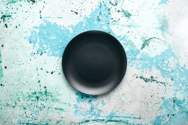 平底锅顶视图空圆形盘子深色的蓝色背景色盘子厨房餐具玻璃视图空的厨具