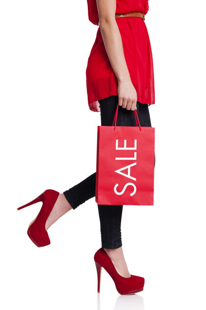移动活动一个低矮的女人拿着她的红色购物袋女人向上移动购物狂