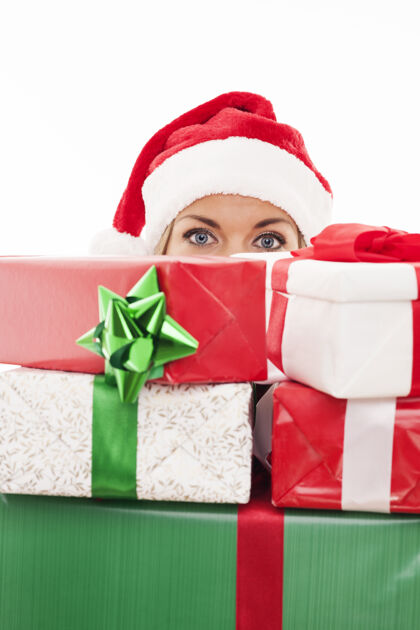 销售当着面拿着圣诞礼物的女人包装纸圣诞帽季节