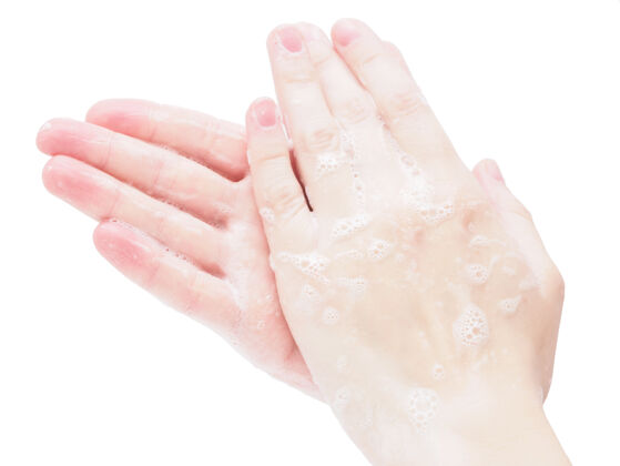 皮肤在白色背景上用抗菌肥皂洗手 特写手潮湿清洁