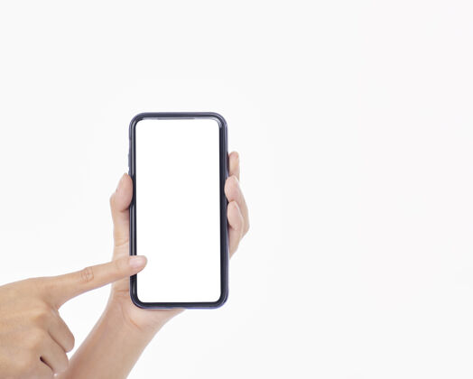 应用程序一个拿着手机的女人 在白色的墙上 特写特写手机空