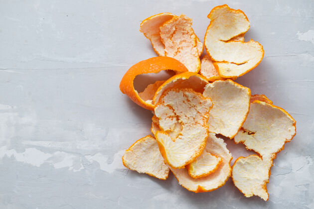 水果橘皮灰陶瓷背景自然橘子螺旋