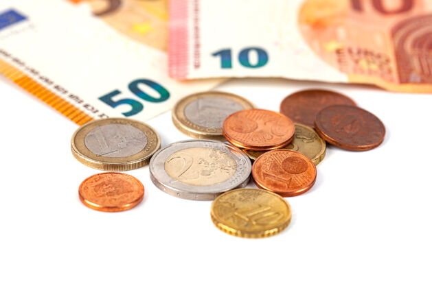 堆一堆白色的欧元硬币和钞票 钱货币货币金融