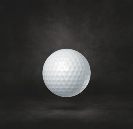 冠军白色的高尔夫球被隔离在黑色的工作室背景上单人房间游戏