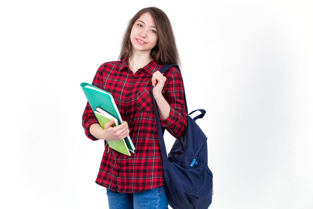 孤独漂亮的女生 带着课本和背包的学生肖像教科书职业