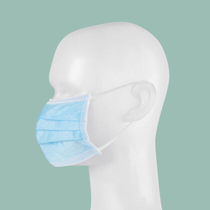 感染蓝色一次性外科面罩在人体模型上蓝色正方形病毒