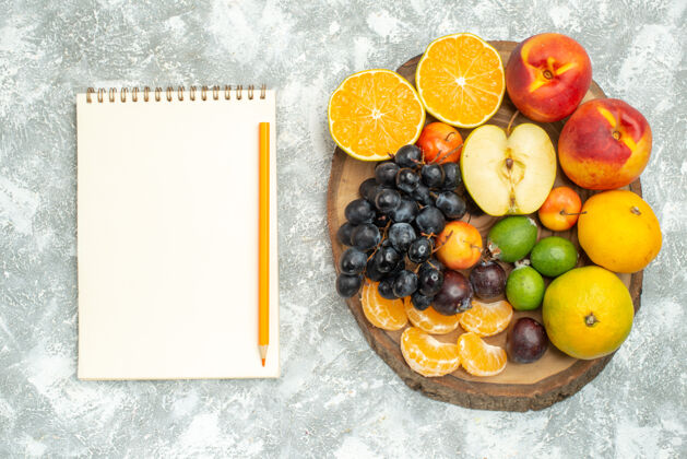 可食用水果顶视图不同的水果成分切片和整个新鲜水果上的白色背景树维生素成熟水果醇厚的颜色新鲜柑橘树