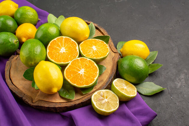 新鲜前视图新鲜酸柠檬在黑暗的背景营养有机正面