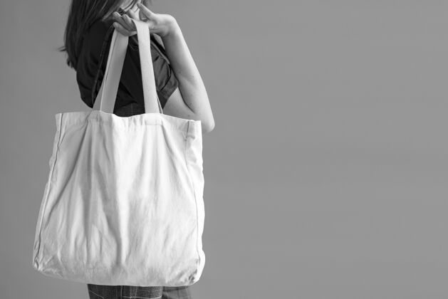 环保带着手提包的女人包灰色设计元素