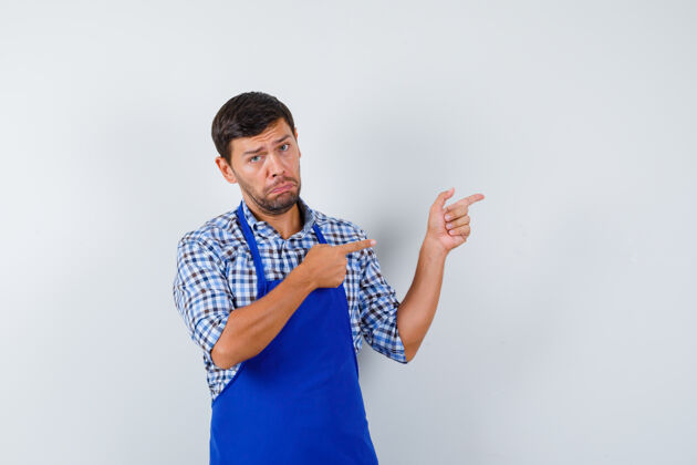 围裙穿着蓝色围裙和衬衫的年轻男厨师男士男士衬衫