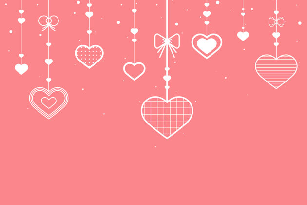 情人节粉红色背景上挂着红心复制空间节日情人节