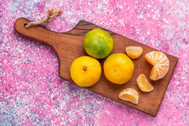 水果粉红色表面的酸鲜橘子俯视图可食用的水果苹果芒果